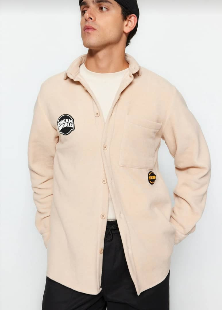 beige labeled shirt - Hover