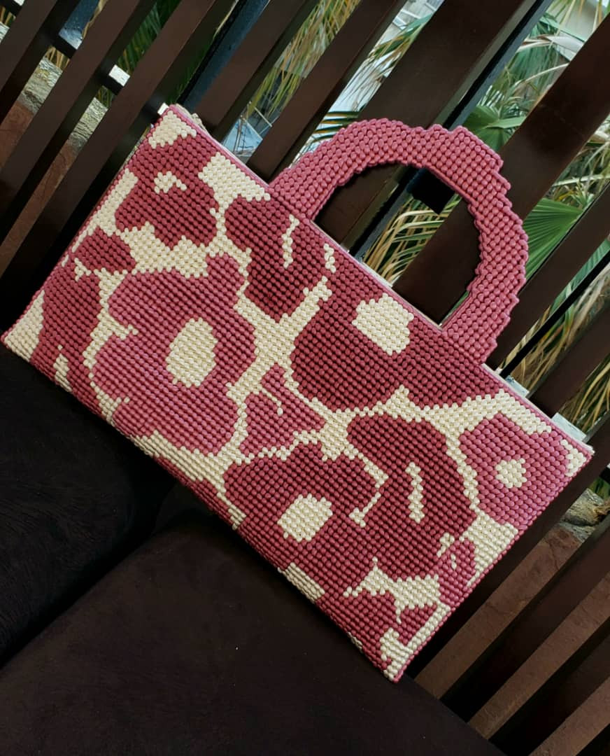 Canvas clutch on mesh handbag