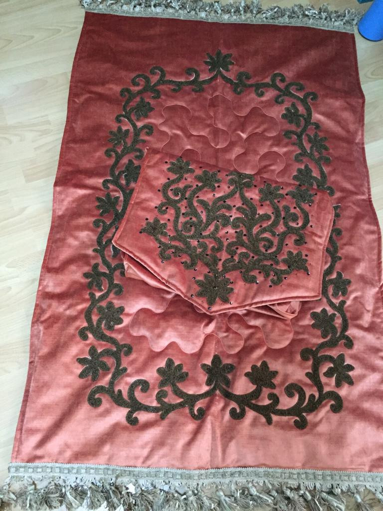 Embroidered prayer rug